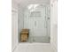 Modern shower with glass enclosure, bench seat, and contemporary tile work at 230 Milton Se Ave, Atlanta, GA 30315