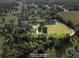 Aerial view of property lines around a home with a large yard and surrounding trees at 2604 Flat Shoals Sw Rd, Conyers, GA 30094