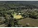 Aerial view of the property showing the house, surrounding trees, and lot boundary at 2604 Flat Shoals Sw Rd, Conyers, GA 30094