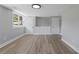 A finished basement with new flooring, updated lighting, and multiple access doors at 2604 Flat Shoals Sw Rd, Conyers, GA 30094