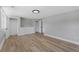 Spacious bedroom features wood-look flooring and neutral paint, plus a walk-in closet for ample storage at 2604 Flat Shoals Sw Rd, Conyers, GA 30094