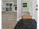 The entryway features stone flooring, light wood flooring, and a view of the living room with a fireplace at 2604 Flat Shoals Sw Rd, Conyers, GA 30094