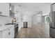 A modern kitchen with stainless steel appliances and open sight lines to an adjacent living space at 2604 Flat Shoals Sw Rd, Conyers, GA 30094