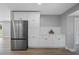 A modern kitchen featuring stainless steel appliances and white cabinets at 2604 Flat Shoals Sw Rd, Conyers, GA 30094