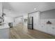 A spacious, modern kitchen with stainless steel appliances and wood grain flooring at 2604 Flat Shoals Sw Rd, Conyers, GA 30094
