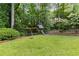 Spacious backyard featuring a charming playset and a well-maintained lawn at 4679 Glenshire Pl, Atlanta, GA 30338