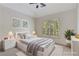 Bedroom features neutral decor, plantation shutters, and vaulted ceiling at 4679 Glenshire Pl, Atlanta, GA 30338