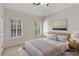 Bedroom featuring neutral décor, natural light, and hardwood floors at 4679 Glenshire Pl, Atlanta, GA 30338