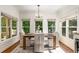 Charming breakfast nook with natural light, elegant finishes, and views of the outdoor greenery at 4679 Glenshire Pl, Atlanta, GA 30338
