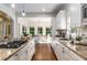 Modern kitchen with white cabinets, granite countertops, stainless steel appliances, and hardwood floors at 4679 Glenshire Pl, Atlanta, GA 30338