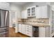 Stylish kitchen featuring white cabinets, granite countertops, and stainless steel appliances at 4679 Glenshire Pl, Atlanta, GA 30338