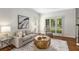 Cozy living room with neutral decor, natural light, and elegant furnishings creating a relaxing atmosphere at 4679 Glenshire Pl, Atlanta, GA 30338