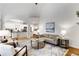 Open concept living room flows into the kitchen with hardwood floors and neutral décor at 4679 Glenshire Pl, Atlanta, GA 30338