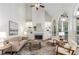 Bright living room with fireplace, built-in shelving, vaulted ceiling, and large windows at 4679 Glenshire Pl, Atlanta, GA 30338
