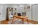 Functional home office with a stylish desk, shelving, and ample natural light at 4679 Glenshire Pl, Atlanta, GA 30338