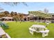 Inviting outdoor gathering space with picnic tables and lawn games for community enjoyment at 4679 Glenshire Pl, Atlanta, GA 30338