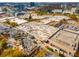 An aerial shot of a large shopping center surrounded by office buildings and autumn trees at 4679 Glenshire Pl, Atlanta, GA 30338