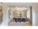 An elegant dining room with modern decor, chandelier lighting, and decorative wallpaper at 81 Homesite Hartsfield Rd, Mcdonough, GA 30253