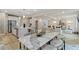 Wide view of the home's open concept, kitchen, dining area, and living room with modern features at 81 Homesite Hartsfield Rd, Mcdonough, GA 30253