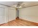 Bedroom featuring hardwood floors and ample closet space for storage at 3539 Evans Mill Rd, Lithonia, GA 30038