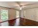 Bedroom featuring hardwood floors, natural light, and an ensuite bathroom at 3539 Evans Mill Rd, Lithonia, GA 30038