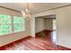 Bright dining room with hardwood floors, natural light, and chandelier at 3539 Evans Mill Rd, Lithonia, GA 30038
