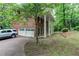 Traditional two-story brick home featuring an attached two-car garage and a lush green lawn at 3539 Evans Mill Rd, Lithonia, GA 30038