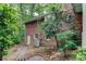 Brick house with a stone path in a wooded setting at 3539 Evans Mill Rd, Lithonia, GA 30038