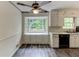 Bright eat-in kitchen with charming window seat and updated flooring at 3539 Evans Mill Rd, Lithonia, GA 30038