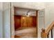 Wood-paneled living area with hardwood floors, ceiling fan and white trim at 3539 Evans Mill Rd, Lithonia, GA 30038
