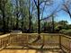 Wood deck with a view of a private and lush backyard surrounded by mature trees at 4103 Laynewood, Tucker, GA 30084