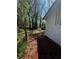 A large backyard offers a white shed and a wooden fence at 4103 Laynewood, Tucker, GA 30084