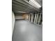 A partially finished basement offers a blank canvas with exposed beams and painted floor at 4103 Laynewood, Tucker, GA 30084