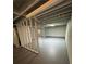 An unfinished basement with painted floors and exposed ceiling for flexible living space at 4103 Laynewood, Tucker, GA 30084