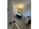Modern bathroom featuring a navy vanity, round mirror, and tiled floors at 4103 Laynewood, Tucker, GA 30084