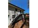 A charming exterior features stairs with wrought iron, and a painted brick at 4103 Laynewood, Tucker, GA 30084