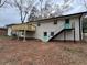 Backyard featuring a charming exterior with a wood deck and stairs to an upstairs entrance at 4103 Laynewood, Tucker, GA 30084