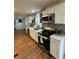 Stylish kitchen featuring stainless steel appliances, sleek countertops, and open layout to living spaces at 4103 Laynewood, Tucker, GA 30084