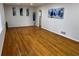 Bright, expansive living room showcasing gleaming hardwood floors and stylish wall decor at 4103 Laynewood, Tucker, GA 30084