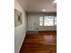 Cozy living room with hardwood floors, a neutral palette, and natural light from front windows at 4103 Laynewood, Tucker, GA 30084