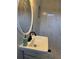 Bathroom sink and walk-in shower with marble-style tiles, black fixtures and a built-in niche at 4103 Laynewood, Tucker, GA 30084