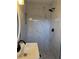 Shower stall with marble style tiles, built in niche and dark shower head at 4103 Laynewood, Tucker, GA 30084