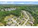 Aerial view showcases a residential neighborhood surrounded by lush green trees and natural landscape at 4388 Cades Pointe, Marietta, GA 30066
