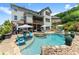 Beautiful backyard featuring a pool, hot tub, deck, and patio for luxurious outdoor living and entertaining at 4388 Cades Pointe, Marietta, GA 30066