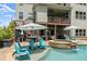 Inviting backyard pool and spa with an umbrella-covered patio area perfect for entertaining at 4388 Cades Pointe, Marietta, GA 30066