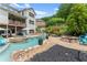 Landscaped backyard with pool, spa, firepit, and patio perfect for outdoor relaxation and entertainment at 4388 Cades Pointe, Marietta, GA 30066