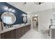 This bathroom features a double vanity, marble countertop, and walk-in closet access at 4388 Cades Pointe, Marietta, GA 30066