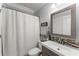 Bright bathroom featuring a mosaic mirror, stylish vanity, and tiled backsplash accents at 4388 Cades Pointe, Marietta, GA 30066