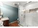 Modern bathroom featuring glass shower, patterned tiling, and granite countertop at 4388 Cades Pointe, Marietta, GA 30066