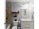 This small bathroom has a vanity with a mirror and a shower over the tub at 4388 Cades Pointe, Marietta, GA 30066